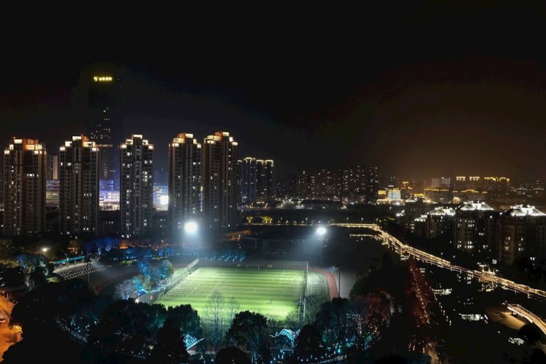 Danyang-Kunshan - a night view of a city with a soccer field