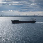 Oresund Bridge - a boat sailing on the water