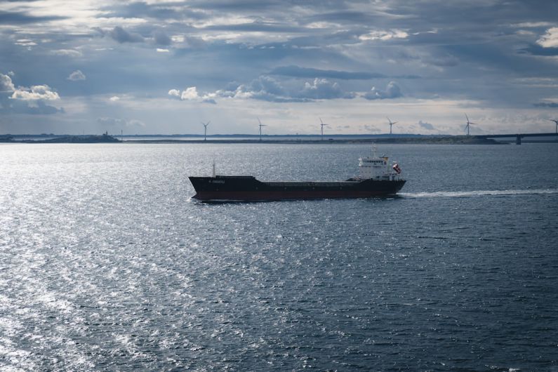 Oresund Bridge - a boat sailing on the water