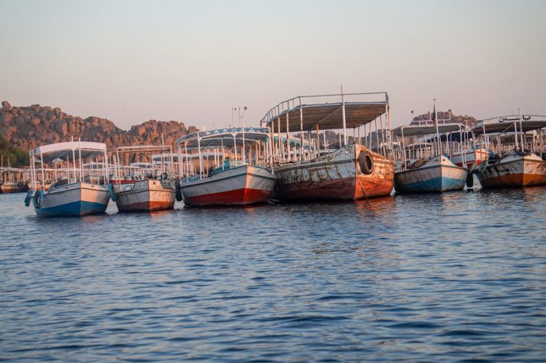 Aswan Dam - boats on body of water at daytime