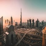 Burj Khalifa - aerial photo of city highway surrounded by high-rise buildings