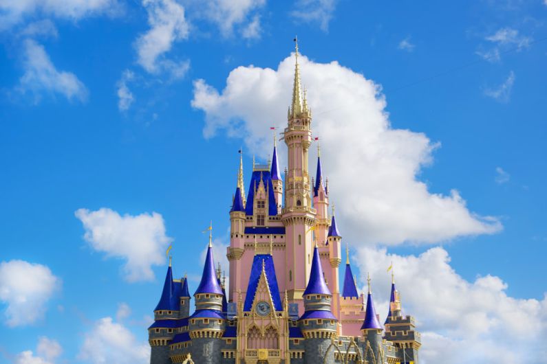 Lotte World - white and blue castle under blue sky during daytime