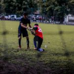 Soccer City - 2 boys playing soccer on green grass field during daytime