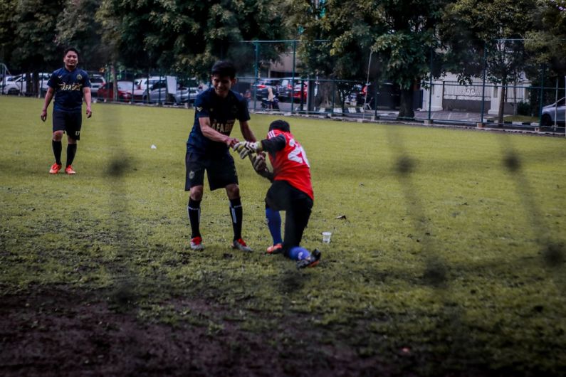 Soccer City - 2 boys playing soccer on green grass field during daytime