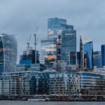 Seoullo Skygarden - a city skyline with tall buildings and a boat in the water