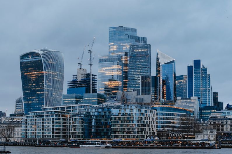 Seoullo Skygarden - a city skyline with tall buildings and a boat in the water