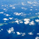 Muraka Maldives - aerial photography of green island and clouds