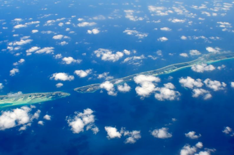 Muraka Maldives - aerial photography of green island and clouds
