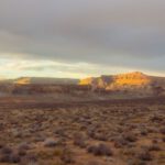 Amangiri Utah - a desert landscape with a mountain in the background