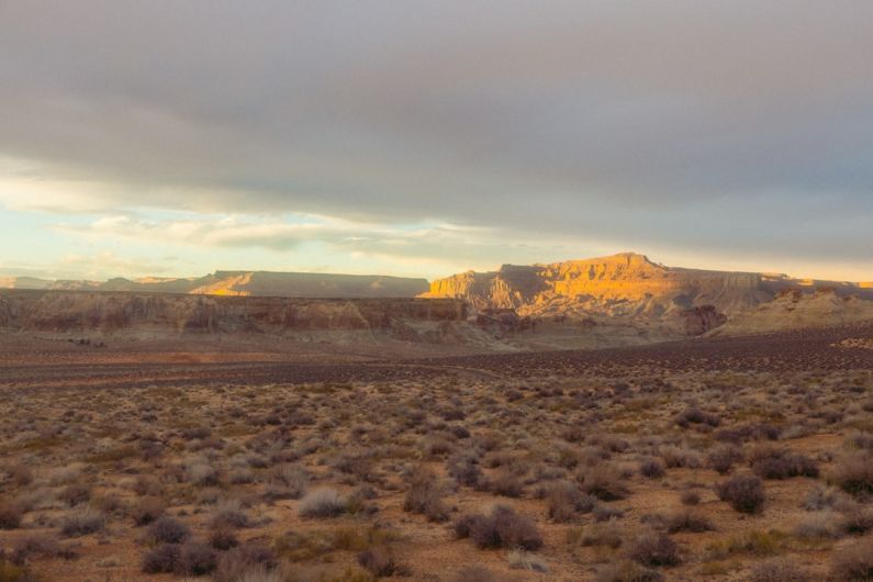 Amangiri Utah - a desert landscape with a mountain in the background