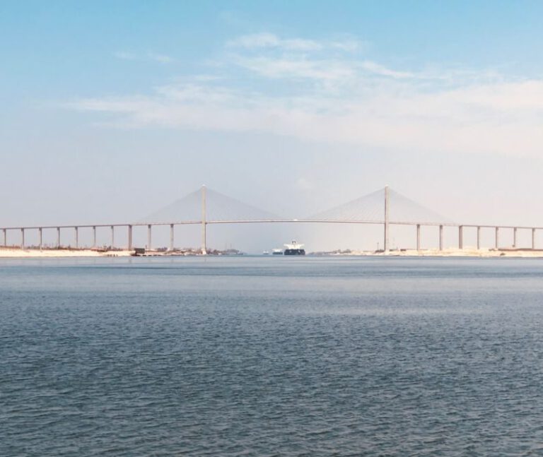 Suez Canal - bridge over the sea under blue sky during daytime