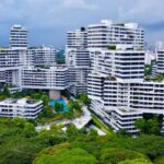 Green Singapore - an aerial view of a city with tall buildings