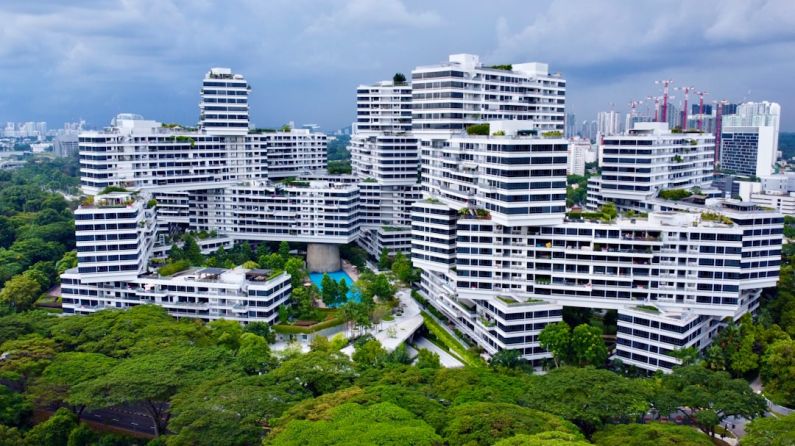 Green Singapore - an aerial view of a city with tall buildings