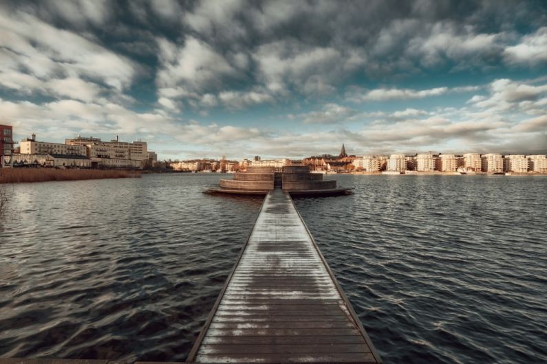 Hammarby Sjöstad - a long dock sitting in the middle of a body of water