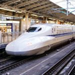 Bullet Train - time lapse photography of white train