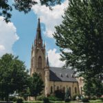 Notre-Dame Reconstruction - a church with a tall steeple