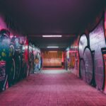 IoT Urban Planning - empty tunnel pathway with graffiti walls