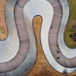 Pedestrianization - an aerial view of a curved walkway in a park