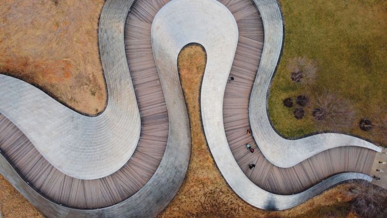Pedestrianization - an aerial view of a curved walkway in a park