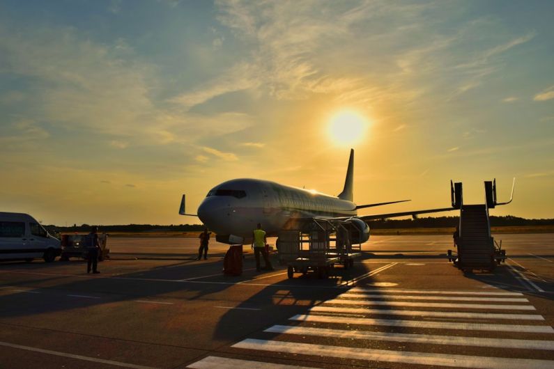 Hyperloop Airport - white airplane parked during daytime