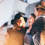 Connected Community - people laughing and talking outside during daytime